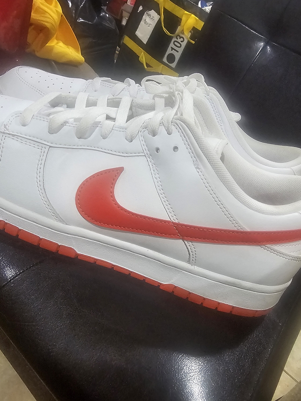 Nike Men’s White Leather Sneakers with Red Swoosh